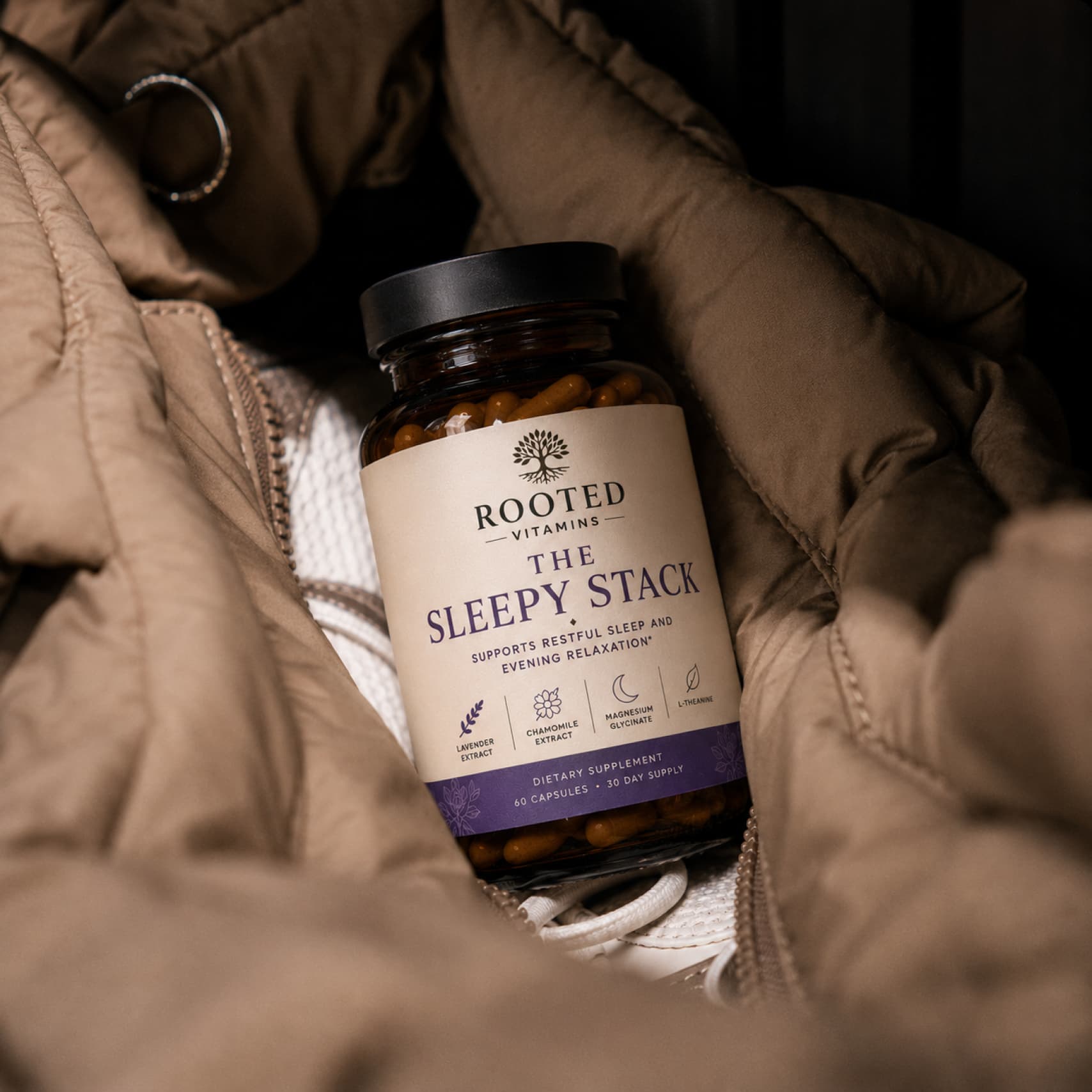 The Sleepy Stack bottle resting on a quilted jacket